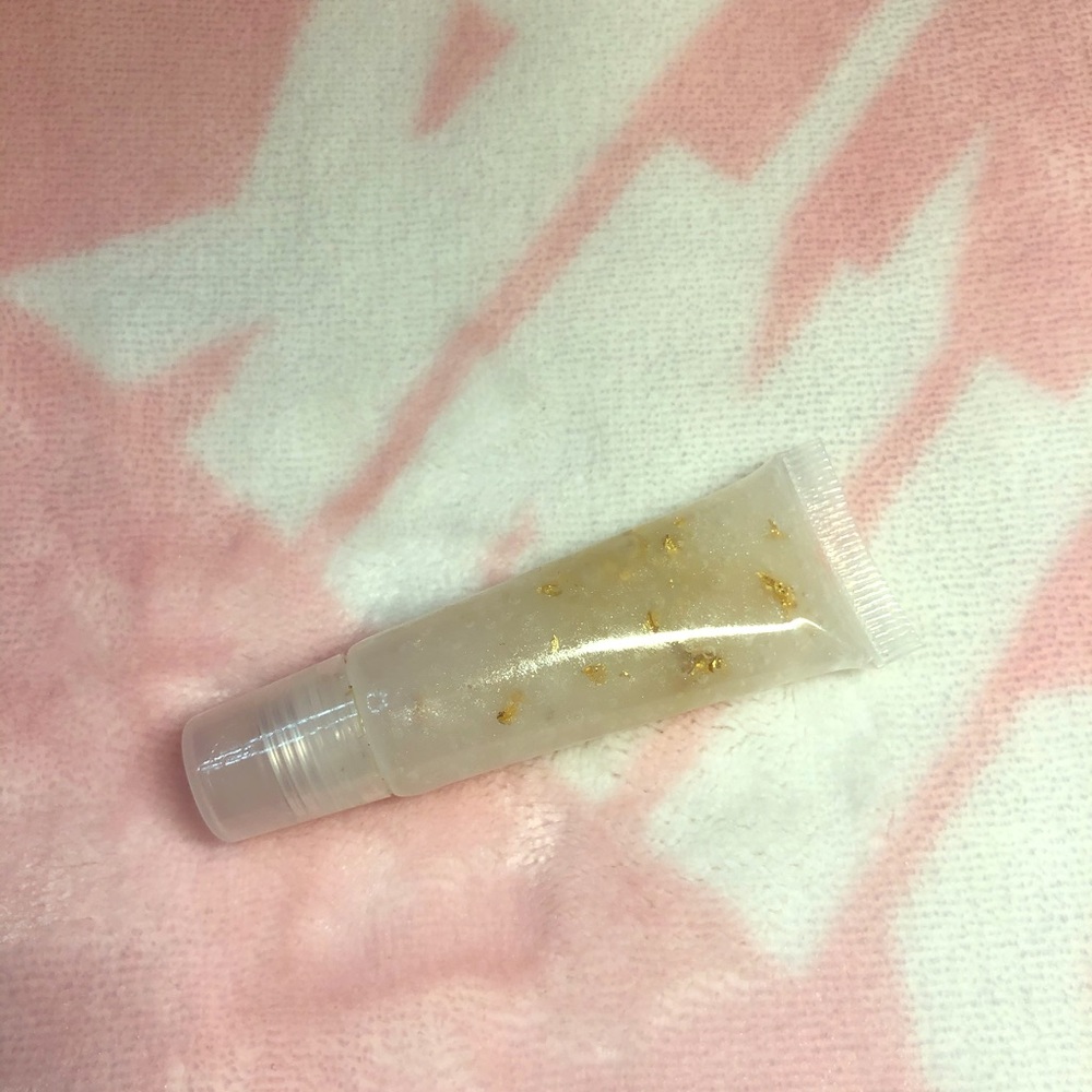 Clear lip gloss with gold flakes